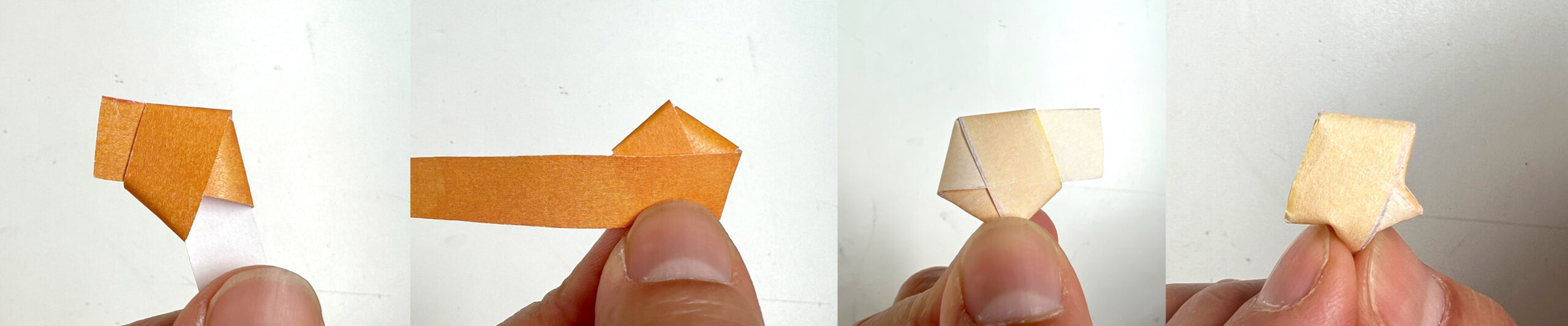 image of a hand holding a paper strip, showing how to fold a small star