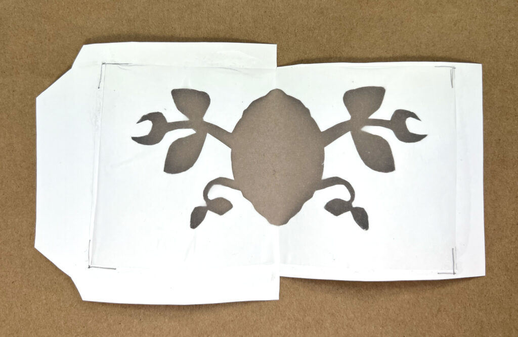 image of a tracing paper glued to the cut-out shape on a paper seed packet
