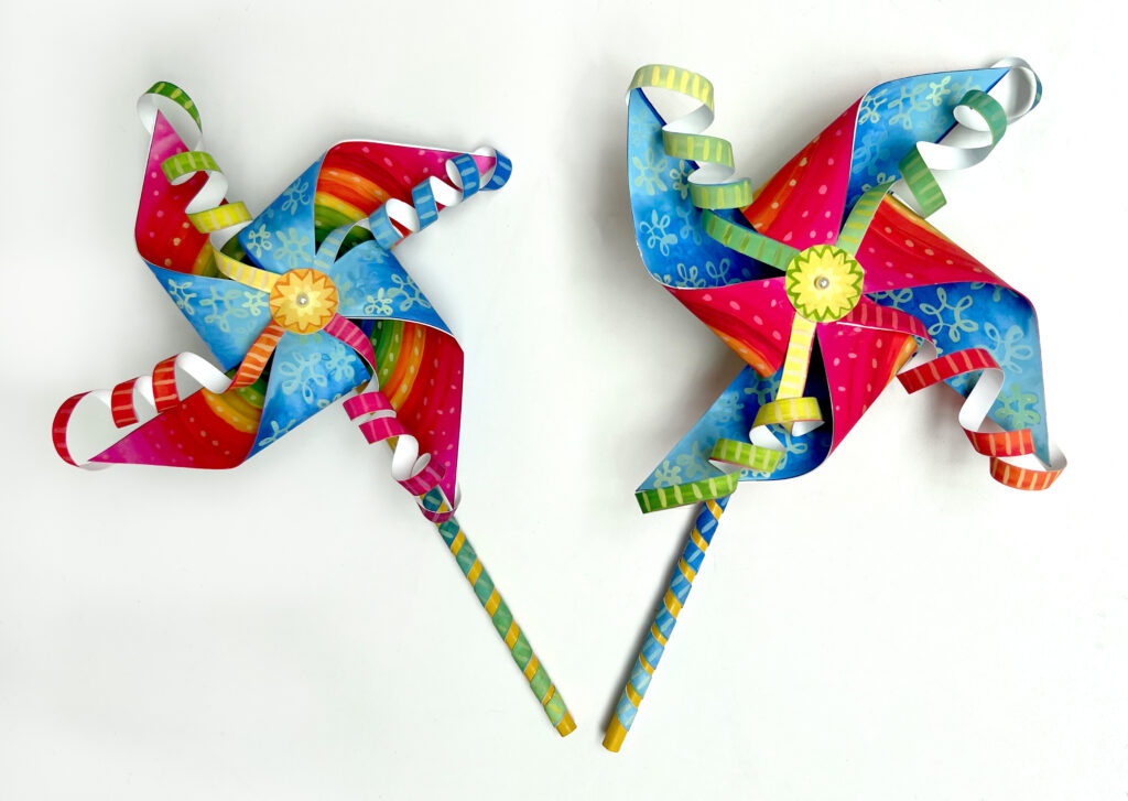 images of two colorful pinwheels handmade with paper and pencils
