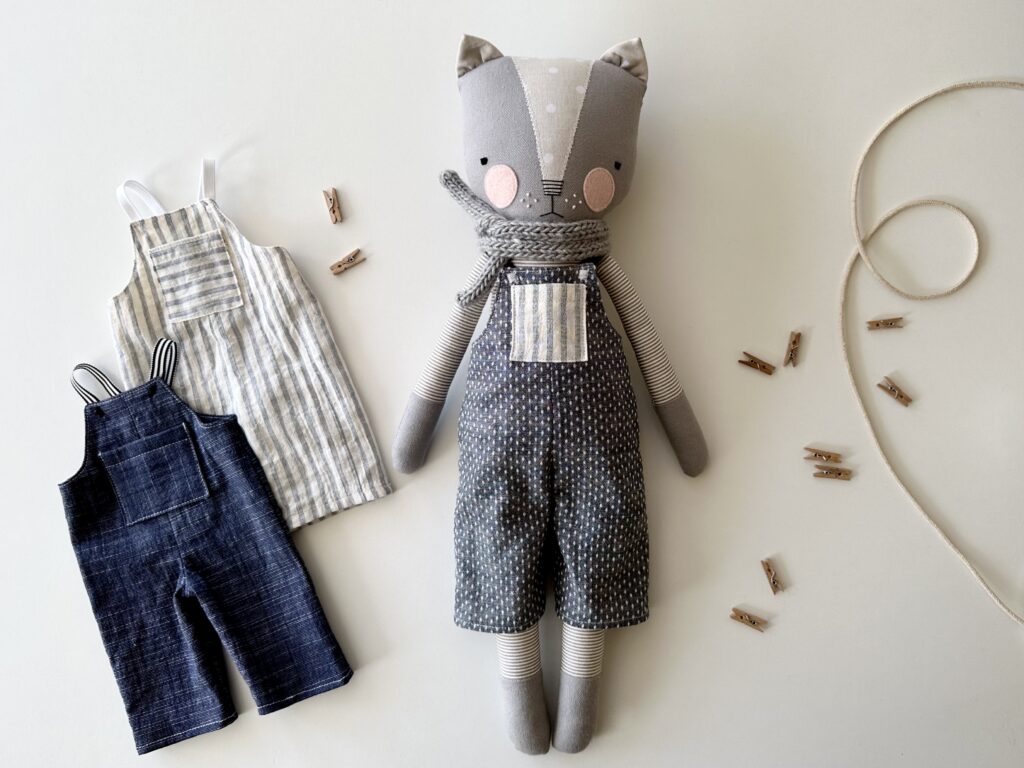image of luckyjuju cat doll made of fabric wearing doll-sized overalls