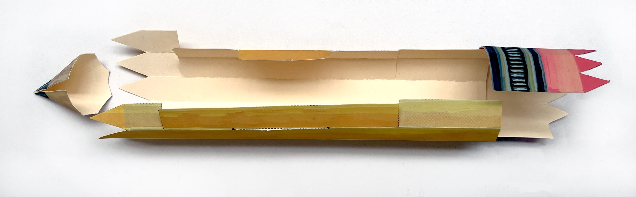 image of an unassembled paper pencil box ready to be glued