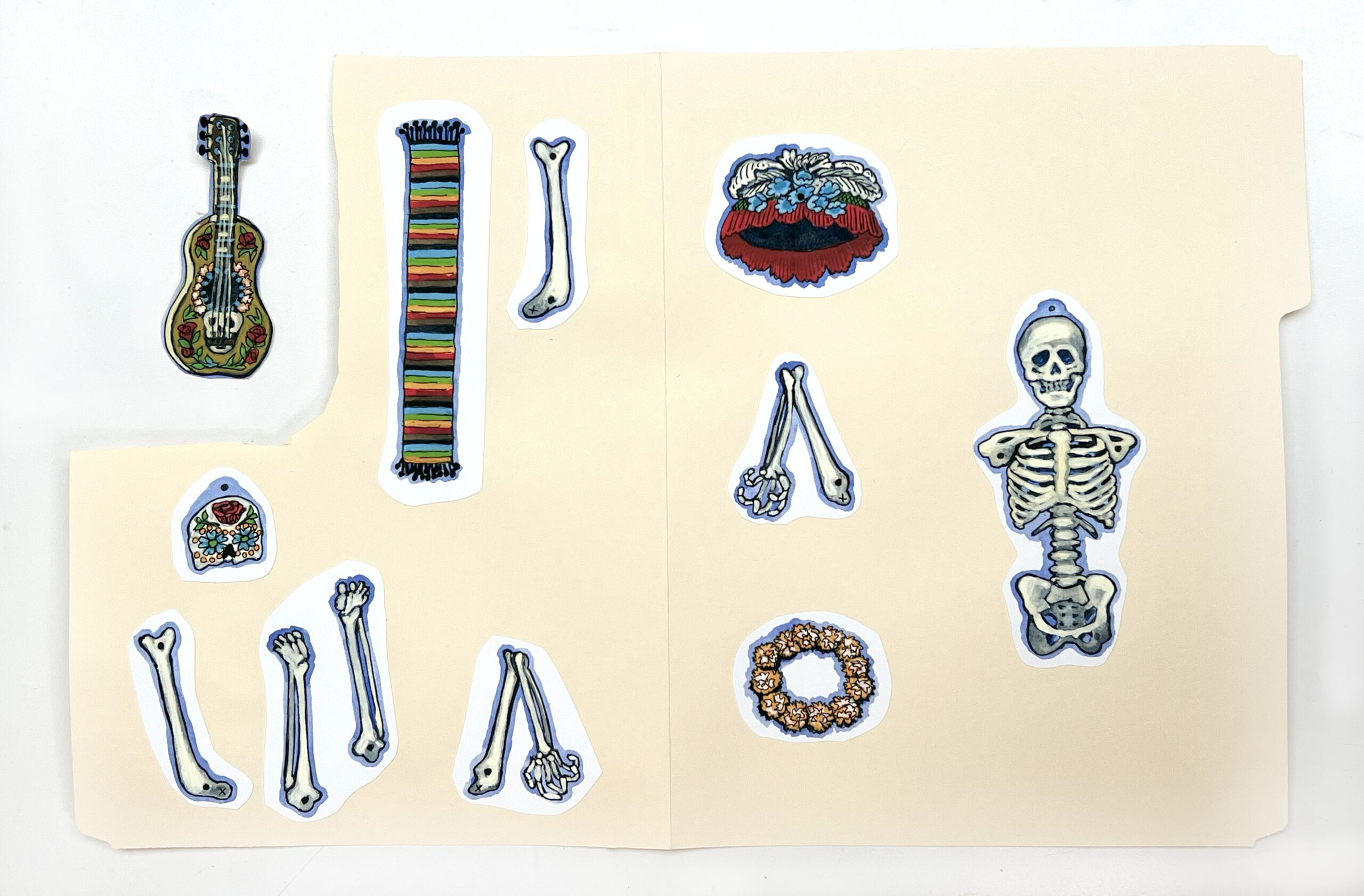 image of paper pieces glued on a file folder to make a paper skeleton